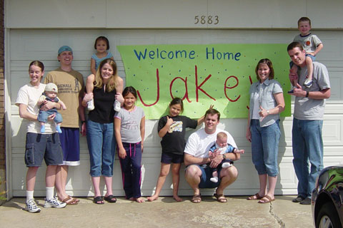 Jake (far right) with family & friends.